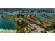 Scenic aerial view of waterfront condo community with tennis courts, playground, and beautiful landscaping at 505 Sandy Hook Rd # 505, Treasure Island, FL 33706
