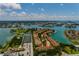 Community aerial view featuring beautiful landscaping, tennis courts, swimming pool and boating docks along the waterfront at 505 Sandy Hook Rd # 505, Treasure Island, FL 33706