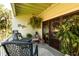 Inviting outdoor balcony offering comfortable seating and views of the landscaped surroundings at 505 Sandy Hook Rd # 505, Treasure Island, FL 33706