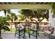 Outdoor balcony offers seating with a view of the community and lush landscaping at 505 Sandy Hook Rd # 505, Treasure Island, FL 33706