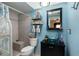 Bathroom featuring a vanity with a vessel sink, decorative accents and shower with tiled walls at 505 Sandy Hook Rd # 505, Treasure Island, FL 33706