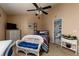 Cozy bedroom featuring nautical decor, light-colored walls and carpeted floors at 505 Sandy Hook Rd # 505, Treasure Island, FL 33706
