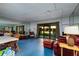 Expansive bonus room with sliding glass doors and mirrored wall at 505 Sandy Hook Rd # 505, Treasure Island, FL 33706