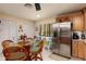 Cozy breakfast nook features bright, natural light and stainless steel refrigerator at 505 Sandy Hook Rd # 505, Treasure Island, FL 33706