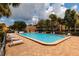 Relaxing community pool with plenty of lounge chairs and palm trees, offering a resort-style atmosphere at 505 Sandy Hook Rd # 505, Treasure Island, FL 33706