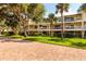 Well-maintained condo complex with lush landscaping and brick paved road at 505 Sandy Hook Rd # 505, Treasure Island, FL 33706