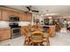 Bright kitchen featuring stainless steel appliances and a cozy breakfast nook, perfect for casual dining at 505 Sandy Hook Rd # 505, Treasure Island, FL 33706
