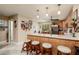 Spacious kitchen with a center island, bar stool seating, and views into the breakfast nook at 505 Sandy Hook Rd # 505, Treasure Island, FL 33706