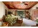 Relaxing main bedroom with wood plank ceilings and a private balcony at 505 Sandy Hook Rd # 505, Treasure Island, FL 33706