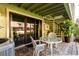 Quaint outdoor patio with spiral staircase and lush landscaping at 505 Sandy Hook Rd # 505, Treasure Island, FL 33706
