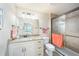The bathroom features a granite countertop, vanity, a toilet, and a glass-enclosed tiled shower at 5065 Royal Palms Way # 303, New Port Richey, FL 34652