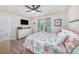 Bedroom with a ceiling fan, light wood-look floors, and large dresser at 5065 Royal Palms Way # 303, New Port Richey, FL 34652