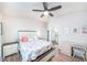 Bedroom with wooden floors, coastal decor, and a ceiling fan at 5065 Royal Palms Way # 303, New Port Richey, FL 34652
