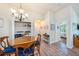 Dining area with wood floors and table, open to living spaces, near a utility closet at 5065 Royal Palms Way # 303, New Port Richey, FL 34652