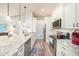 Kitchen with white cabinetry, stainless appliances, and granite countertops at 5065 Royal Palms Way # 303, New Port Richey, FL 34652