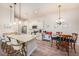 Bright kitchen with white cabinetry, granite counters, island seating, and stainless appliances at 5065 Royal Palms Way # 303, New Port Richey, FL 34652
