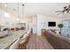 Open-concept living room with a large island counter and a comfortable seating area at 5065 Royal Palms Way # 303, New Port Richey, FL 34652