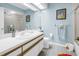 A bright, kid-friendly bathroom featuring a white vanity, neutral tile, and playful decor for a fun and clean space at 5090 White Pine Ne Cir, St Petersburg, FL 33702