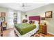 A cozy bedroom with bright natural light, decorated with colorful accents and unique furniture for a personal touch at 5090 White Pine Ne Cir, St Petersburg, FL 33702