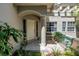 Inviting front porch with a cozy seating area and meticulously maintained plants at 5090 White Pine Ne Cir, St Petersburg, FL 33702