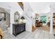 Bright entryway with a staircase, tile flooring, and decorative furniture at 5090 White Pine Ne Cir, St Petersburg, FL 33702