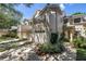 Lovely townhouse with an attached two-car garage and beautiful front yard landscaping at 5090 White Pine Ne Cir, St Petersburg, FL 33702
