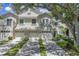 Charming townhouse with well-maintained landscaping, a two-car garage and a balcony at 5090 White Pine Ne Cir, St Petersburg, FL 33702