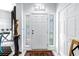 Bright foyer with decorative sidelights and white door at 5090 White Pine Ne Cir, St Petersburg, FL 33702