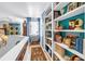 Bright hallway with built-in bookshelves lining the walls, creating a cozy and inviting reading nook at 5090 White Pine Ne Cir, St Petersburg, FL 33702