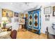 A vibrant home office is adorned with unique art, furniture and a colorful armoire, enhancing the room's character at 5090 White Pine Ne Cir, St Petersburg, FL 33702