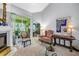 Elegant living room featuring a fireplace, comfortable seating, and sliding glass door at 5090 White Pine Ne Cir, St Petersburg, FL 33702