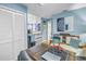 Bright office featuring ample workspace, unique decor, and a view into the adjacent living area at 5090 White Pine Ne Cir, St Petersburg, FL 33702