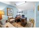 Comfortable office space with a large desk, plush seating, and eclectic decor for a productive atmosphere at 5090 White Pine Ne Cir, St Petersburg, FL 33702