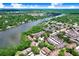 Beautiful aerial view of lakefront community with mature trees and community pool at 5103 Puritan Cir # 5103, Tampa, FL 33617
