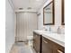 Bathroom with a double vanity, neutral color scheme, and ample storage space at 5103 Puritan Cir # 5103, Tampa, FL 33617