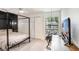 Stylish bedroom featuring a modern black canopy bed, trendy hanging chair, and a sleek TV at 5103 Puritan Cir # 5103, Tampa, FL 33617