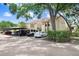 Well-maintained condo building with covered parking and mature landscaping at 5103 Puritan Cir # 5103, Tampa, FL 33617