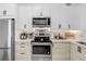 Kitchen featuring white cabinets and stainless steel appliances at 5103 Puritan Cir # 5103, Tampa, FL 33617