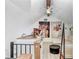 Charming loft area with artwork, plants, and comfortable seating; great view of the main floor at 5103 Puritan Cir # 5103, Tampa, FL 33617