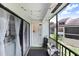 Relax on this charming screened-in patio with string lights and views of the lush surroundings at 5103 Puritan Cir # 5103, Tampa, FL 33617