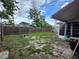 Spacious backyard with a wooden fence, grassy areas, and a patio at 5221 82Nd N Ave, Pinellas Park, FL 33781
