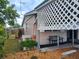 Exterior view of the side of the house with a wooden fence and a seating area at 5221 82Nd N Ave, Pinellas Park, FL 33781