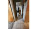 Hallway showcasing tile flooring, doorframes, and an open view to another room at 5221 82Nd N Ave, Pinellas Park, FL 33781