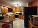 A kitchen featuring light wooden cabinets, modern appliances, and functional design at 5221 82Nd N Ave, Pinellas Park, FL 33781