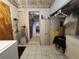 Functional laundry area with a tile floor, storage cabinets, and laundry machines at 5221 82Nd N Ave, Pinellas Park, FL 33781
