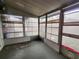 Enclosed sunroom featuring multiple sliding windows and a ceiling fan at 5221 82Nd N Ave, Pinellas Park, FL 33781