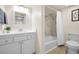 Bright bathroom features a new vanity, mirror and shower at 55 Rogers St # 502, Clearwater, FL 33756