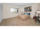Cozy bedroom with a ceiling fan, natural light, and hardwood floors at 55 Rogers St # 502, Clearwater, FL 33756