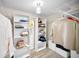 Walk-in closet with custom shelving offers optimal storage space at 55 Rogers St # 502, Clearwater, FL 33756
