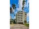 Well-maintained condo building with a private driveway and tropical landscaping, offering a serene living environment at 55 Rogers St # 502, Clearwater, FL 33756